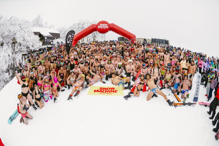 group of travelers at snow machine at niseko ski resort in Japan